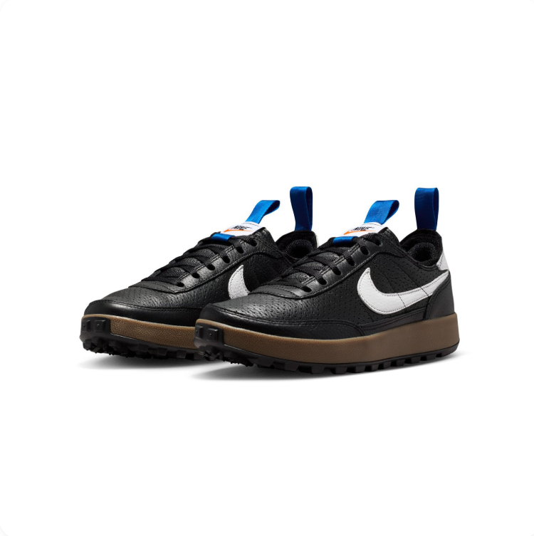 Nike Black and White Gum-Sole Sneakers with Blue Pull Tabs
