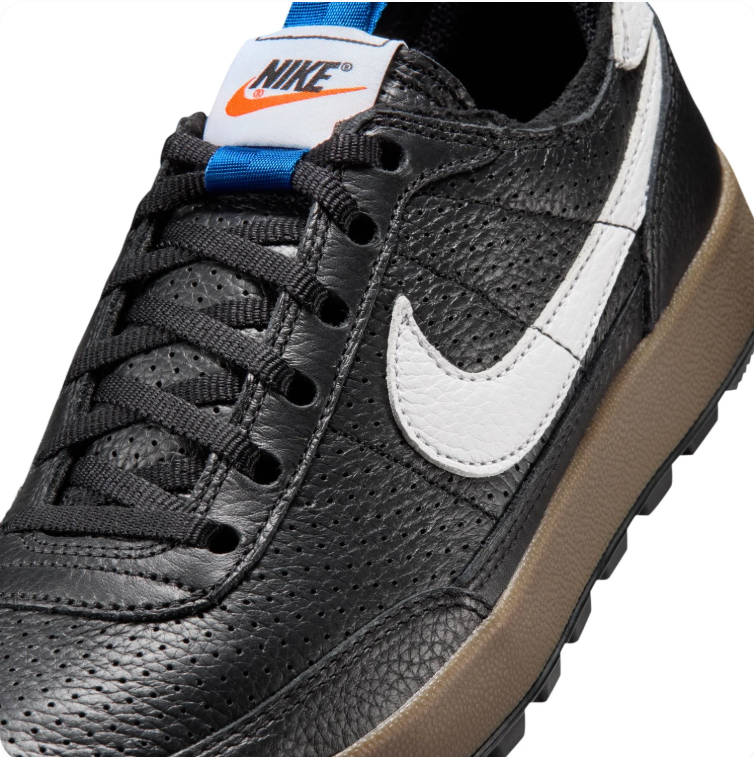 Nike Black and White Gum-Sole Sneakers with Blue Pull Tabs